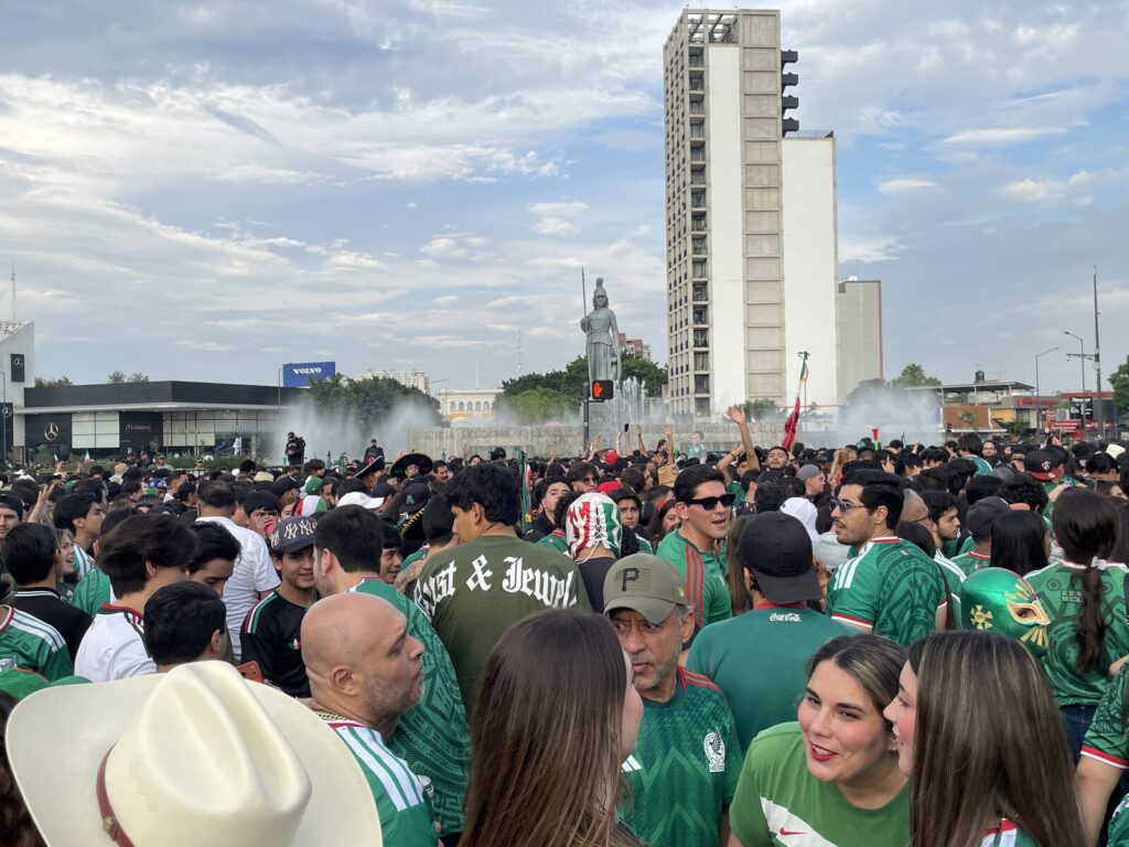 Mexican fans celebrate during a 2026 FIFA World Cup match at the Glorieta de la Minerva in Guadalajara