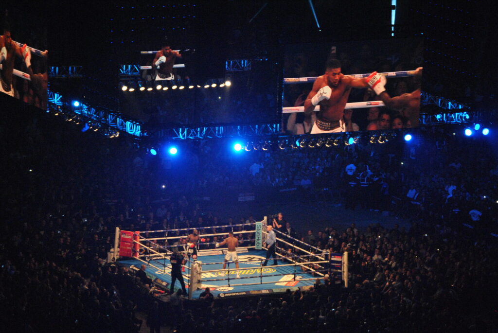Anthony Joshua throwing a punch in the ring during a heavyweight boxing bout, file photo from a 2017 fight