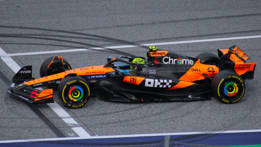 McLaren's papaya-orange Formula 1 car, driven by Lando Norris, on track during the 2025 Austrian Grand Prix weekend.