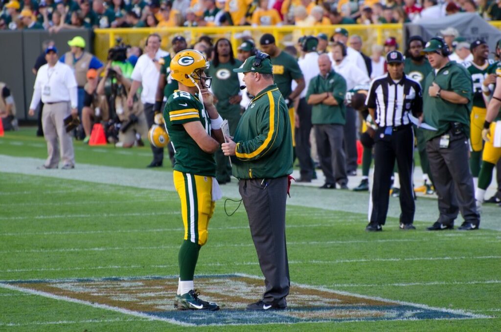 Aaron Rodgers and Mike McCarthy on the sideline during a Green Bay Packers game