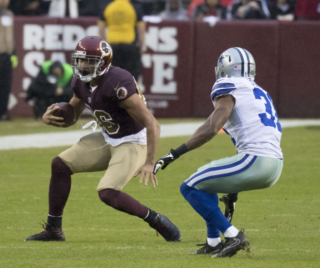 NFL players in game action, illustrating a story about void years in player contracts