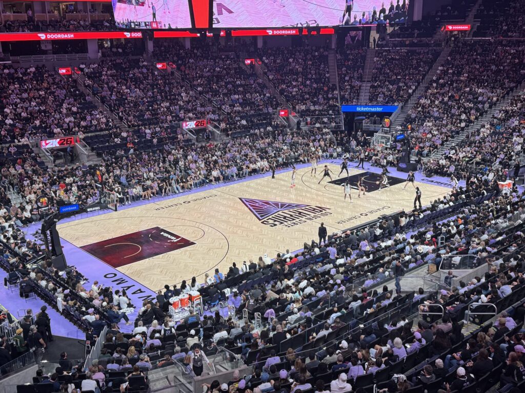 Wide view of a Golden State Valkyries WNBA game in progress at a packed Chase Center.