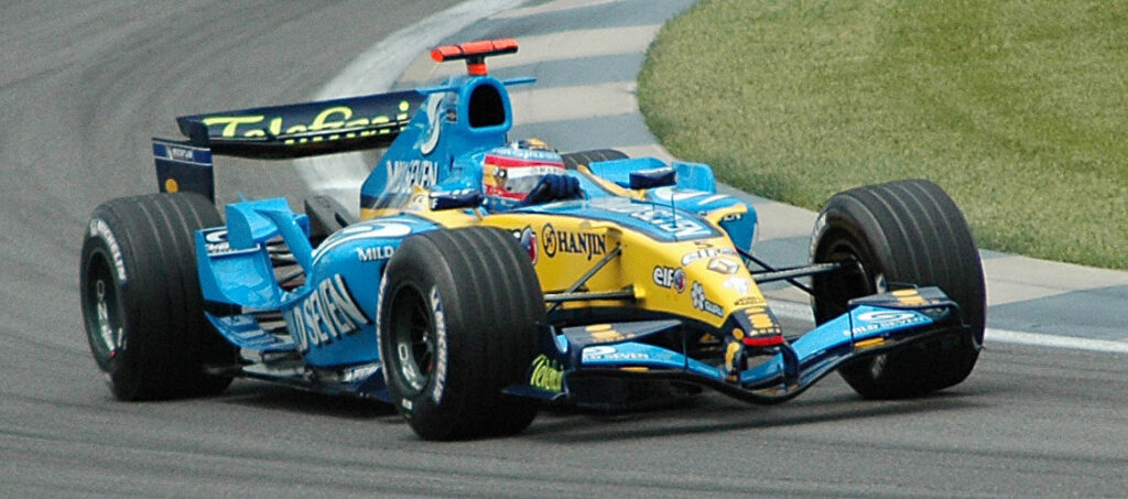 Fernando Alonso driving the Renault F1 car through a corner during qualifying at the 2005 United States Grand Prix