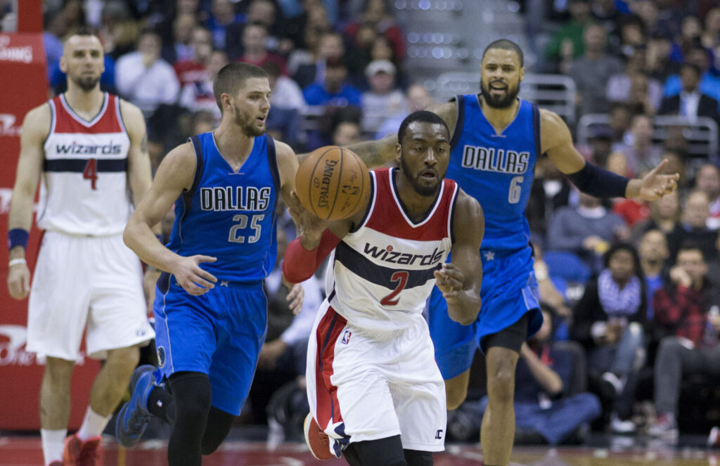 NBA players battling for position during in-game action between the Washington Wizards and Dallas Mavericks