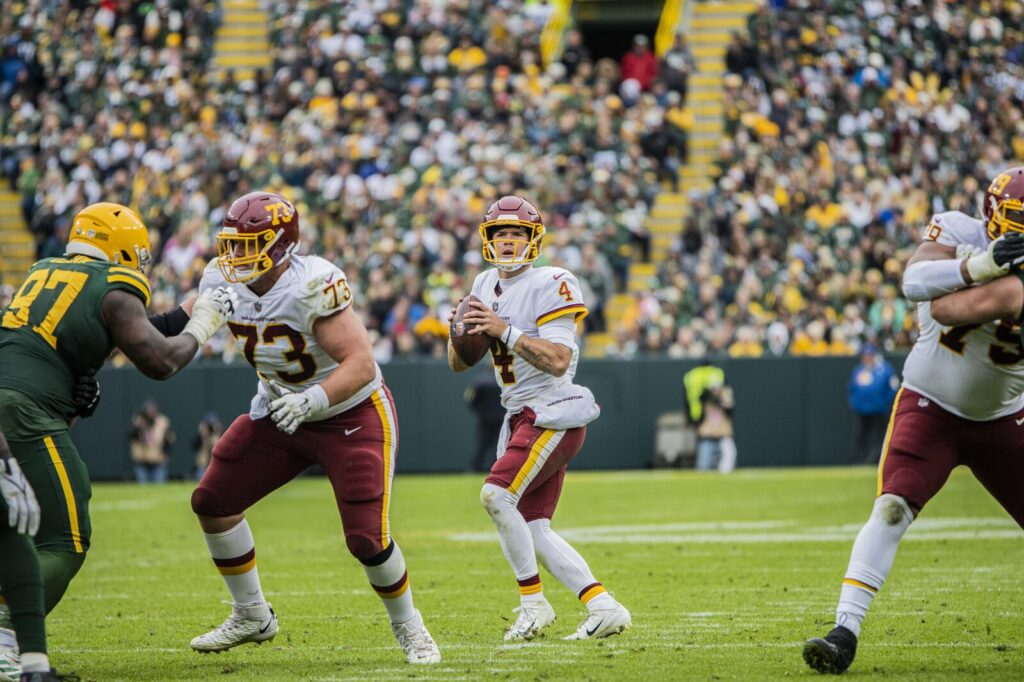 NFL players in action during a Washington Football Team vs. Green Bay Packers game at Lambeau Field